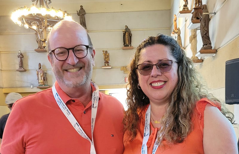 Two LFM Academy participants in orange tops.