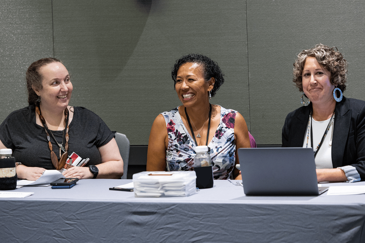 Conference attendees engaged in a conversation.