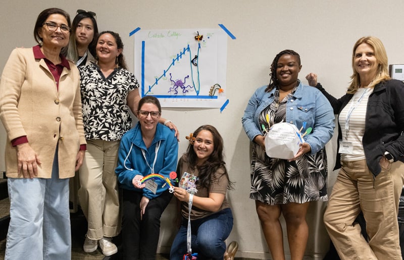Leading from the Middle project team posing around their project.